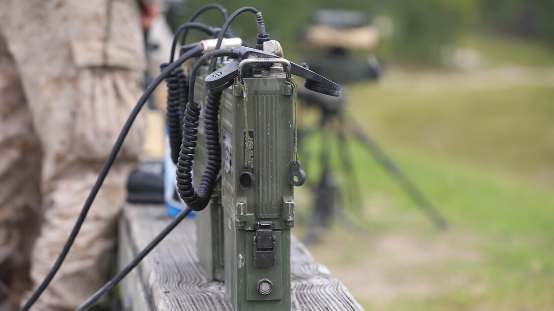 The Marines conducting fire support training use PRC-117 radios to communicate between ground and air troops during the exercise on Camp Lejeune, N.C., Sept. 17, 2015. The radios enable Marines to communicate the approved orders from the fire support coordination center. 