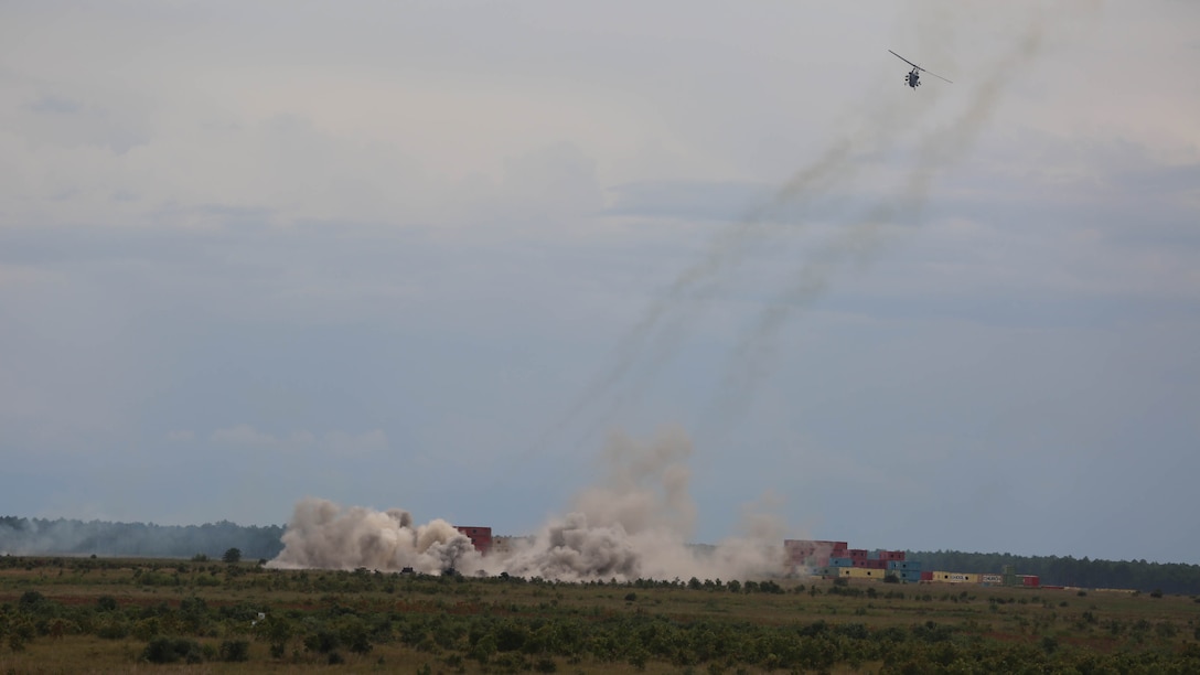 An AH-1 Cobra, an AV-8B Harrier, and an UH-1 Huey were used as air support for the artillery fire support training conducted on Camp Lejeune, N.C., Sept. 17, 2015. FST uses the combined arms of mortars, artillery and air support to effectively suppress the enemy. 