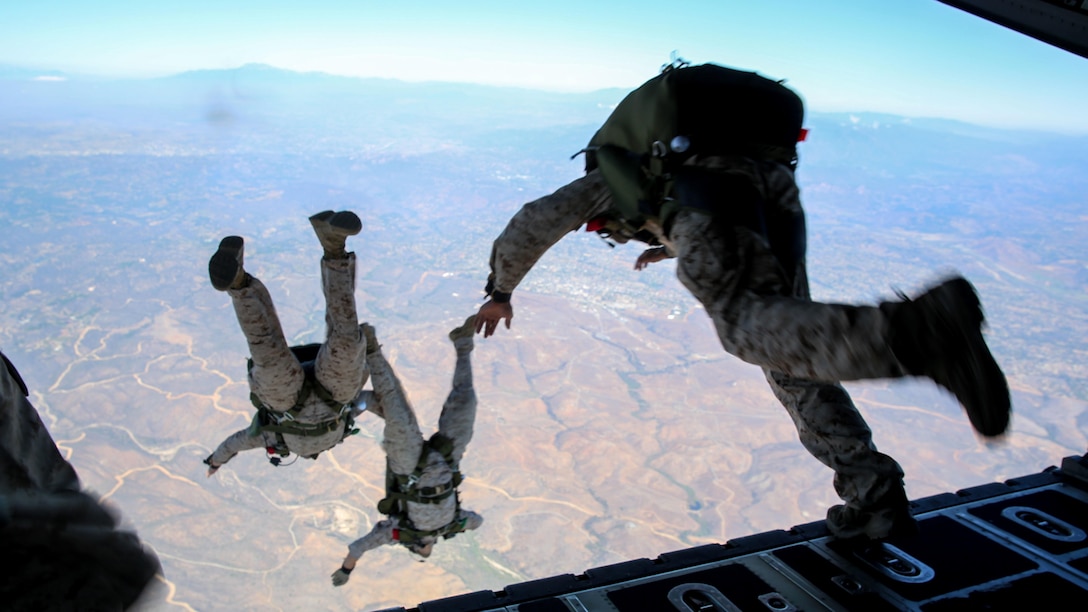 Marines with Force Reconnaissance Company and Reconnaissance Training Company, 1st Reconnaissance Battalion, 1st Marine Division, jump from a C-130J Super Hercules aircraft during High Altitude – High Opening parachute insertion training over Marine Corps Base Camp Pendleton, Calif., Sept. 17, 2015. The goal of the training was to sharpen a skill set that is of great advantage to expeditionary forces, allowing the jumpers to infiltrate locations where access would be too difficult for vehicles. 