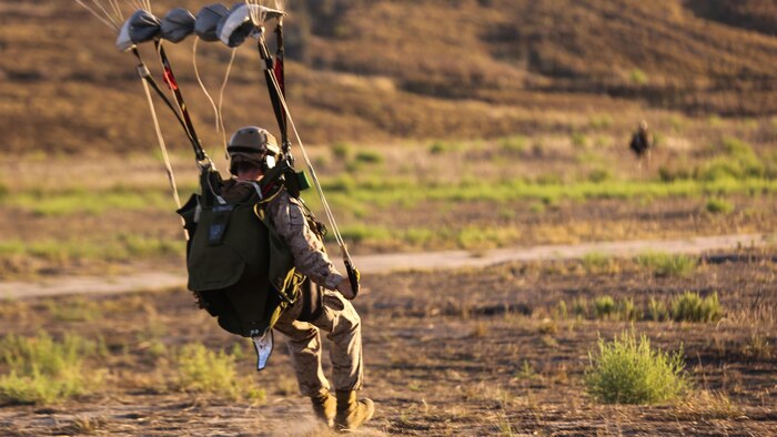 A Marine with 1st Reconnaissance Battalion, 1st Marine Division lands at his designated drop zone following a High Altitude – High Opening insertion event at Marine Corps Base Camp Pendleton, Calif., Sept. 17, 2015. The goal of the training was to sharpen a skill set that is of great advantage to expeditionary forces, allowing the jumpers to infiltrate locations where access would be too difficult for vehicles.