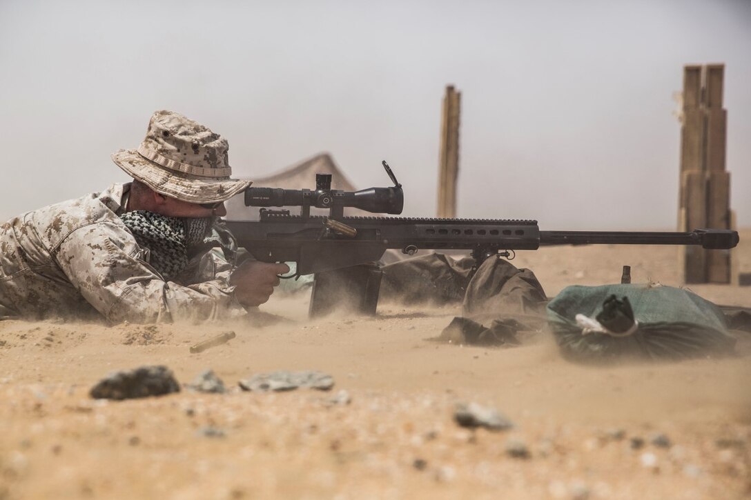 KUWAIT (Aug. 30, 2015) U.S. Marine Cpl. Andrew Scott fires a special application scoped rifle at a target during a sniper shoot. Scott is a scout sniper with Weapons Company, Battalion Landing Team, 3rd Battalion, 1st Marine Regiment, 15th Marine Expeditionary Unit. During the training, Marines engaged targets at unknown distances ranging from 300 to more than 1,000 yards. Elements of the 15th MEU are ashore in Kuwait for sustainment training to maintain and enhance the skills they developed during their pre-deployment training period.  The 15th MEU is embarked aboard the Essex Amphibious Ready Group and deployed to maintain regional security in the U.S. 5th Fleet area of operations. (U.S. Marine Corps photo by Sgt. Emmanuel Ramos/Released)