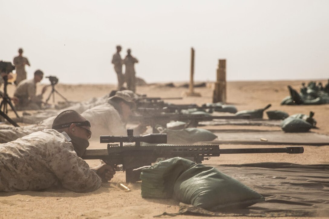 KUWAIT (Aug. 30, 2015) U.S. Marine scout snipers with Weapons Company, Battalion Landing Team, 3rd Battalion, 1st Marine Regiment, 15th Marine Expeditionary Unit, fire special application scoped rifles at targets during a sniper shoot. During the training, Marines engaged targets at unknown distances ranging from 300 to more than 1,000 yards. Elements of the 15th MEU are ashore in Kuwait for sustainment training to maintain and enhance the skills they developed during their pre-deployment training period.  The 15th MEU is embarked aboard the Essex Amphibious Ready Group and deployed to maintain regional security in the U.S. 5th Fleet area of operations. (U.S. Marine Corps photo by Sgt. Emmanuel Ramos/Released)