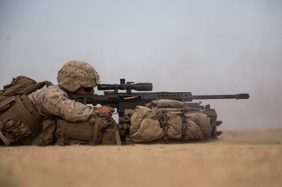 KUWAIT (Aug. 31, 2015) U.S. Marine Cpl. Erik Troutz fires a special application scoped rifle at a target during a sniper shoot. Troutz is a scout sniper with Weapons Company, Battalion Landing Team, 3rd Battalion, 1st Marine Regiment, 15th Marine Expeditionary Unit. During the training, Marines engaged targets at unknown distances ranging from 300 to more than 1,000 yards. Elements of the 15th MEU are ashore in Kuwait for sustainment training to maintain and enhance the skills they developed during their pre-deployment training period.  The 15th MEU is embarked aboard the Essex Amphibious Ready Group and deployed to maintain regional security in the U.S. 5th Fleet area of operations. (U.S. Marine Corps photo by Sgt. Emmanuel Ramos/Released)