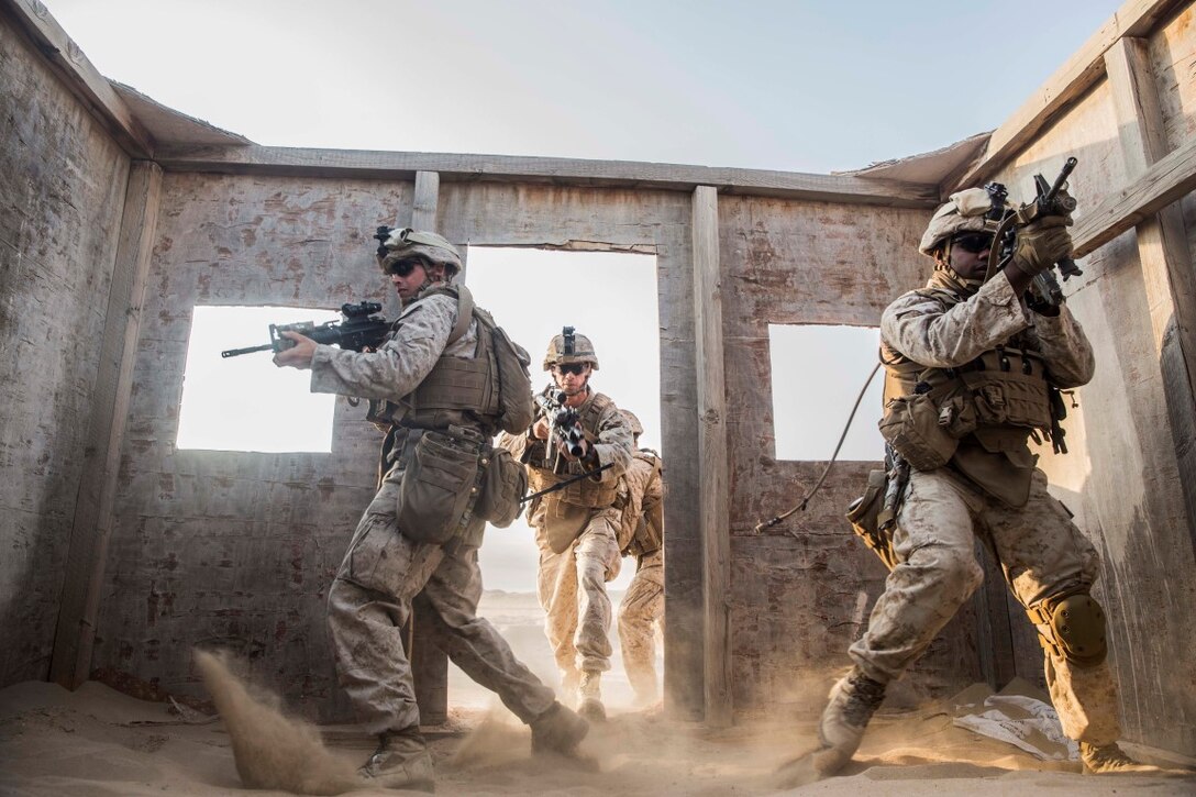 KUWAIT (Aug. 28, 2015) U.S. Marines with Kilo Company, Battalion Landing Team 3rd Battalion, 1st Marine Regiment, 15th Marine Expeditionary Unit, rehearse room-clearing techniques during military operations in urban terrain training. During the training Marines rehearsed patrolling through urban areas and immediate action drills. Elements of the 15th MEU are ashore in Kuwait for sustainment training to maintain and enhance the skills they developed during their pre-deployment training period.  The 15th MEU is embarked aboard the Essex Amphibious Ready Group and deployed to maintain regional security in the U.S. 5th Fleet area of operations. (U.S. Marine Corps photo by Sgt. Emmanuel Ramos/Released)