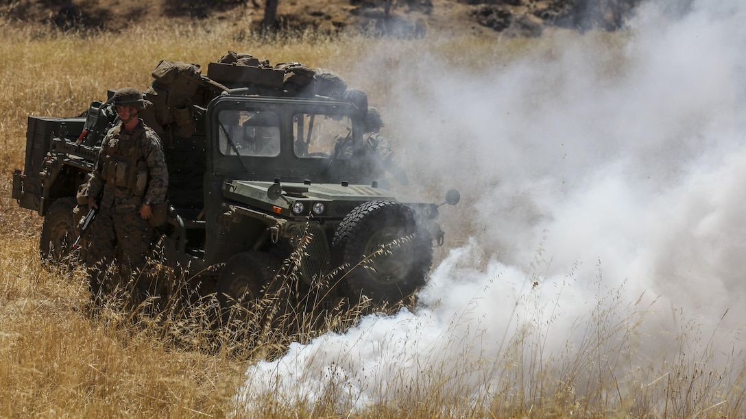 Marines with Company B, 1st Battalion, 1st Marine Regiment, 1st Marine Division, assess a simulated downed Internally Transported Vehicle (ITV) during a patrol as part of an experimental exercise at Fort Hunter Liggett, Calif., Aug. 30, 2015. The experimental exercise allowed the Marines with the Marine Corps Warfighting Lab to determine the success of ITV integration with the ground combat element, assess the vehicles capabilities and establish new guidelines for future ITVs to come.
