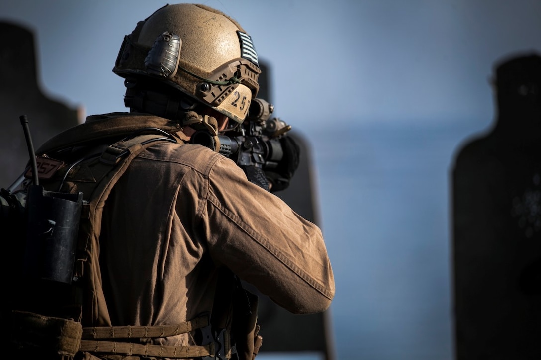 ARABIAN GULF (Sept. 21, 2015) A U.S. Marine with the 15th Marine Expeditionary Unit’s Maritime Raid Force engages his target while moving during a deck shoot aboard the amphibious assault ship USS Essex (LHD 2). The 15th MEU is embarked aboard the Essex Amphibious Ready Group and deployed to maintain regional security in the U.S. 5th Fleet area of operations. (U.S. Marine Corps photo by Cpl. Elize McKelvey/Released)