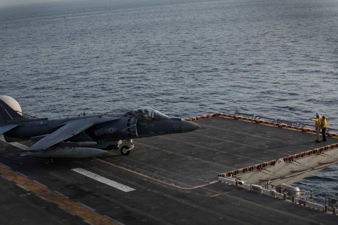ARABIAN GULF (Sept. 19, 2015) An AV-8B Harrier with Medium Marine Tiltrotor Squadron 161 (Reinforced), 15th Marine Expeditionary Unit, returns to the amphibious assault ship USS Essex (LHD 2) after flying missions in support of Operation Inherent Resolve. The 15th MEU is embarked aboard the Essex Amphibious Ready Group and deployed to maintain regional security in the U.S. 5th Fleet area of operations. (U.S. Marine Corps photo by Cpl. Elize McKelvey/Released)