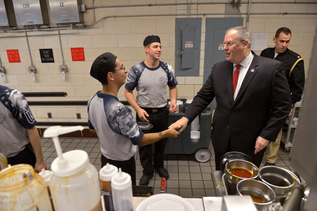 Deputy Defense Secretary Bob Work makes his rounds to offer a handshake and coins to galley staff on Groton Submarine Base in New London, Conn., Sept 22, 2015. DoD photo by Glenn Fawcett