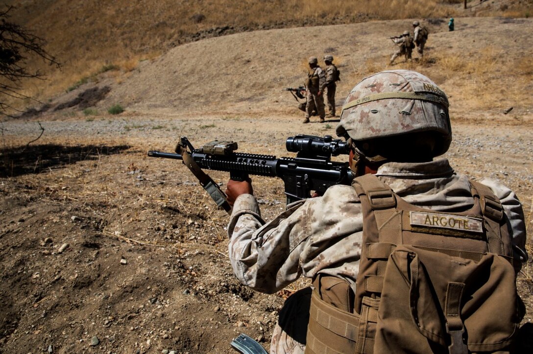 Los Angeles native, Cpl. Ernesto Argote, a combat engineer with 1st Combat Engineer Battalion, 1st Marine Division, I Marine Expeditionary Force, holds security for his fire team for live fire and maneuver training during Exercise Pioneer Express at Camp Roberts, Calif., Sept. 7, 2015. The exercise provides an opportunity for both individual and collective training for the Marines and the unit and ensures they remain equipped, ready and relevant for future operations. 
