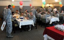 15th Wing Airmen enjoy lunch served to them by members of the Hawaii First Sergeants Association in celebration of their birthday  at the Hale Aina Dining Facility, Joint Base Pearl Harbor-Hickam, Hawaii, Sept. 17, 2015. The guests of honor were Airmen born in June, July and August. The quarterly birthday meal was the first of its kind at JBPHH in 17 years. (U.S. Air Force photo by Tech. Sgt. Terri Paden/Released)