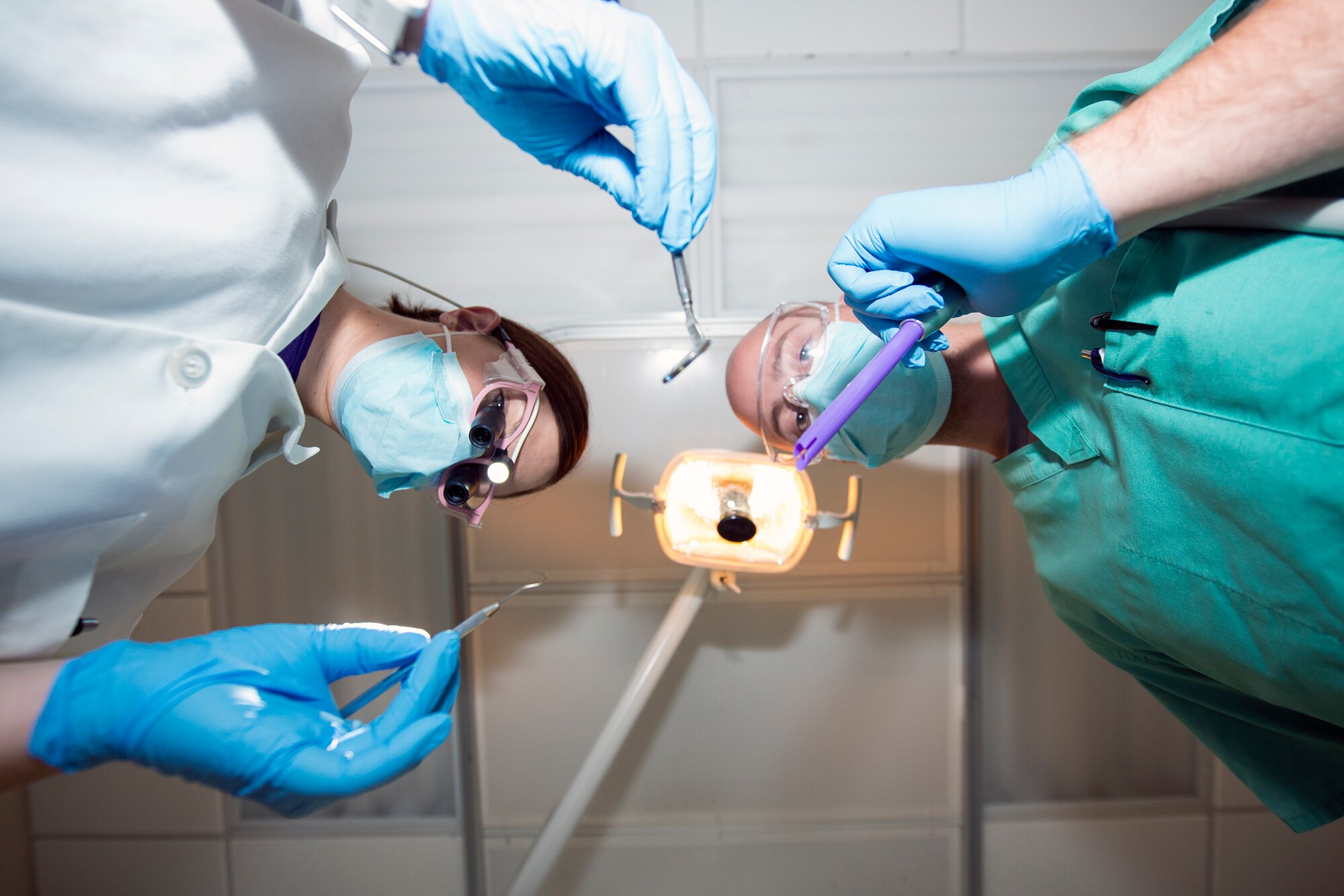 U.S. Air Force Capt. (Dr.) Christianna Moore (left), 23d Aerospace Medicine Squadron officer in charge of preventative dentistry, and Evan Crossland, 23d AMDS dental assistant, hold dental equipment Sept. 18, 2015, at Moody Air Force Base, Ga. The dental clinic provides routine dental cleaning and annual check-ups for Department of Defense personnel and dependents. (U.S. Air Force photo by Airman 1st Class Greg Nash/Released)   