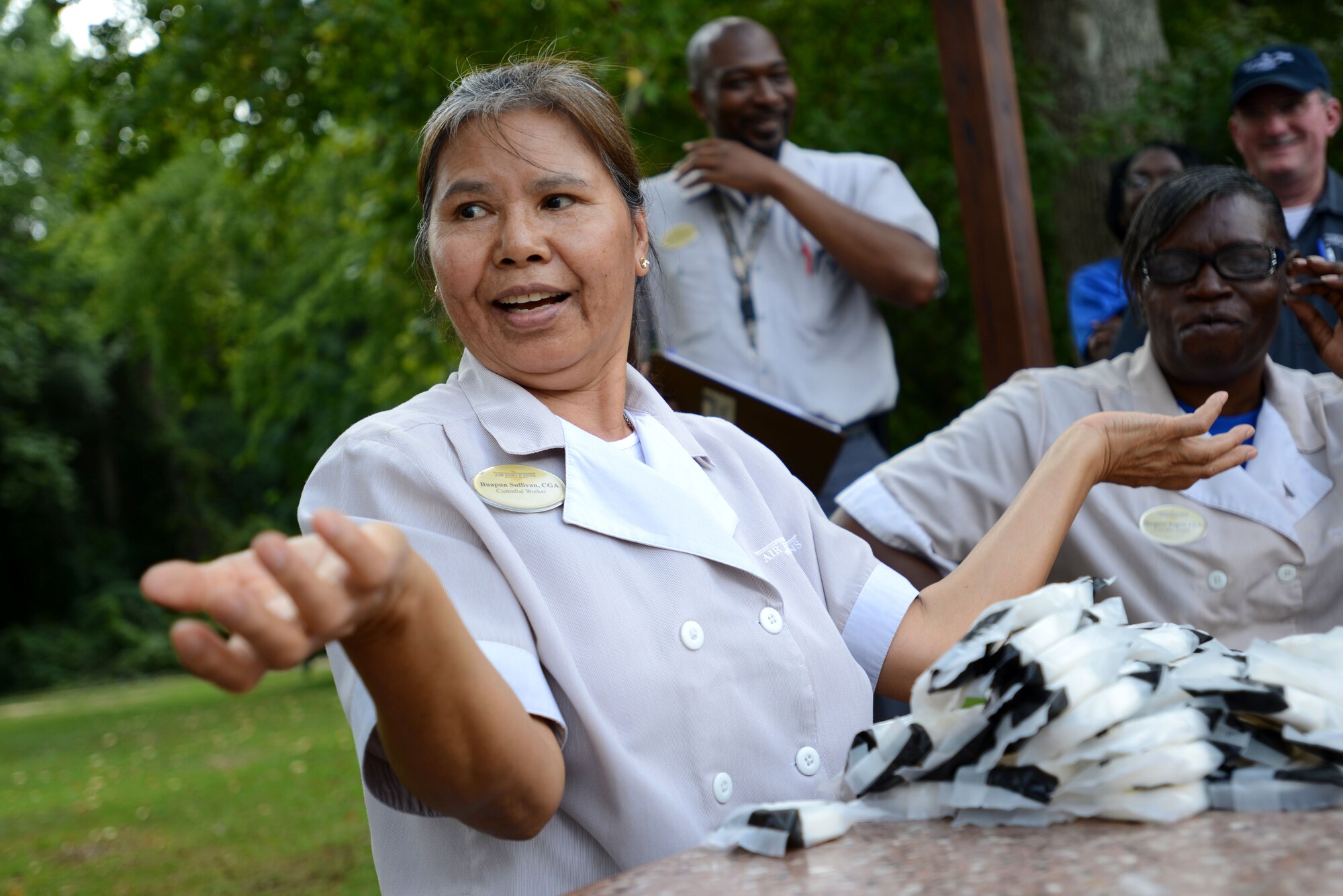 Lek Sullivan, 20th Force Support Squadron custodial worker, reacts as her tower of soap collapses just before time runs out during International Housekeeping Week at Shaw Air Force Base, S.C., Sept. 17, 2015. Participants had one minute to build their tower, with the tallest still standing at the end winning a prize. (U.S. Air Force photo by Airman 1st Class Kelsey Tucker/Released)