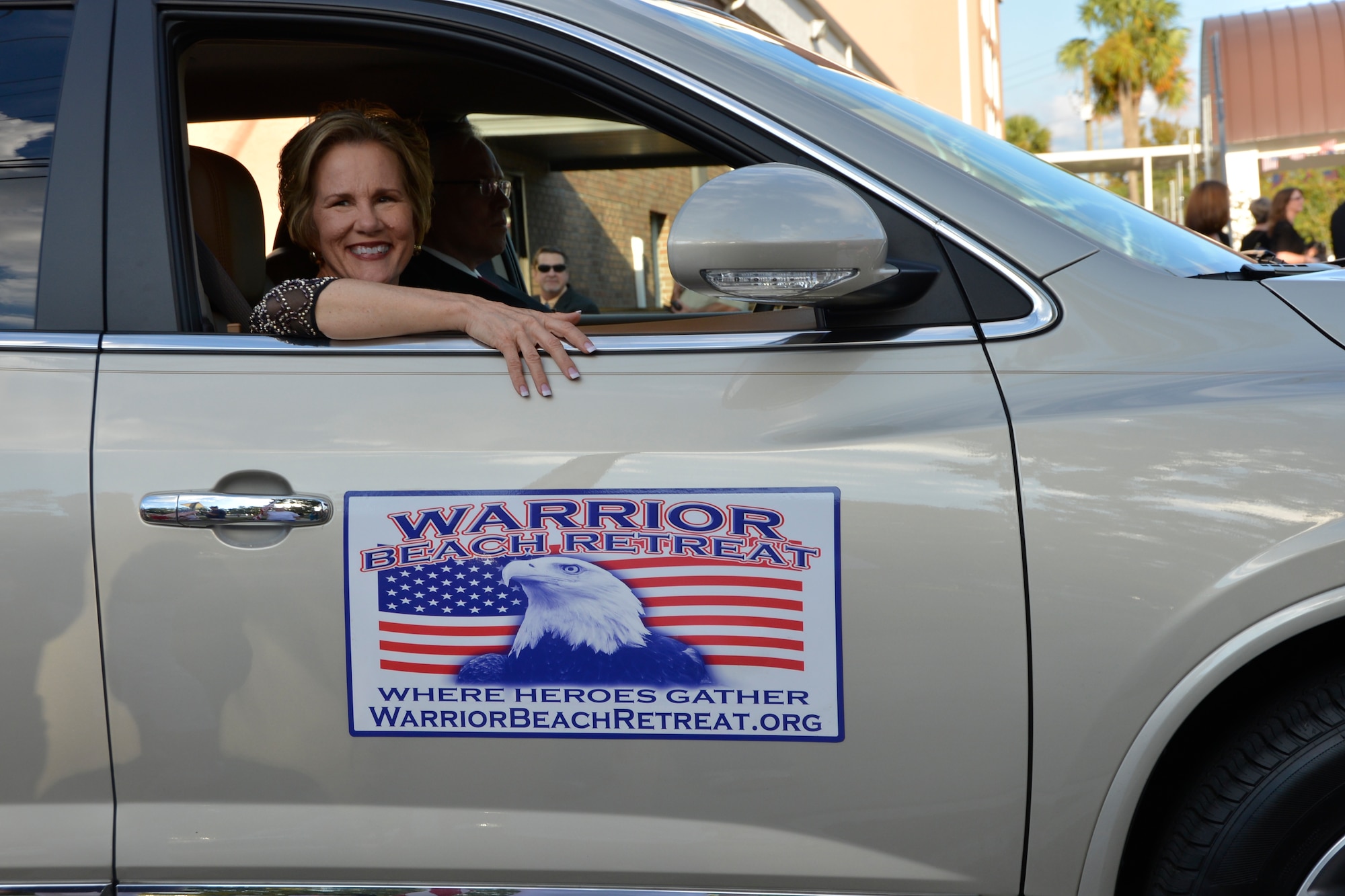PANAMA CITY, Fla. – Linda Cope, Warrior Beach Retreat, Inc. founder, smiles at well-wishers as she arrives at the inaugural welcome ceremony for Warrior Beach Retreat participants Sept. 17 at a church in Panama City. Cope’s son, Joshua, an Operation  Iraqi Freedom veteran, lost both his legs and injured his hands after an improvised explosive device attack in Baghdad in 2006. The Retreat honors wounded warriors by bringing them and their spouse or caregiver to Panama City Beach, Fla., for a week of rest and relaxation. (Air Force Photo Released/Mary McHale)



