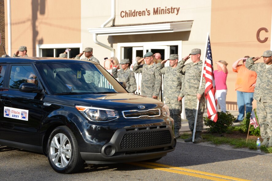 PANAMA CITY, Fla. - Students from the Paul Airey Noncommissioned Officer Academy at Tyndall Air Force Base, Fla., salute vehicles of wounded warriors during Warrior Beach Retreat Sept. 17 as they arrive for the inaugural welcome at a local church in Panama City. The Retreat honors wounded warriors by bringing them and their spouse or caregiver to Panama City Beach, Fla., for a week of rest and relaxation. (Air Force Photo Released/Mary McHale)