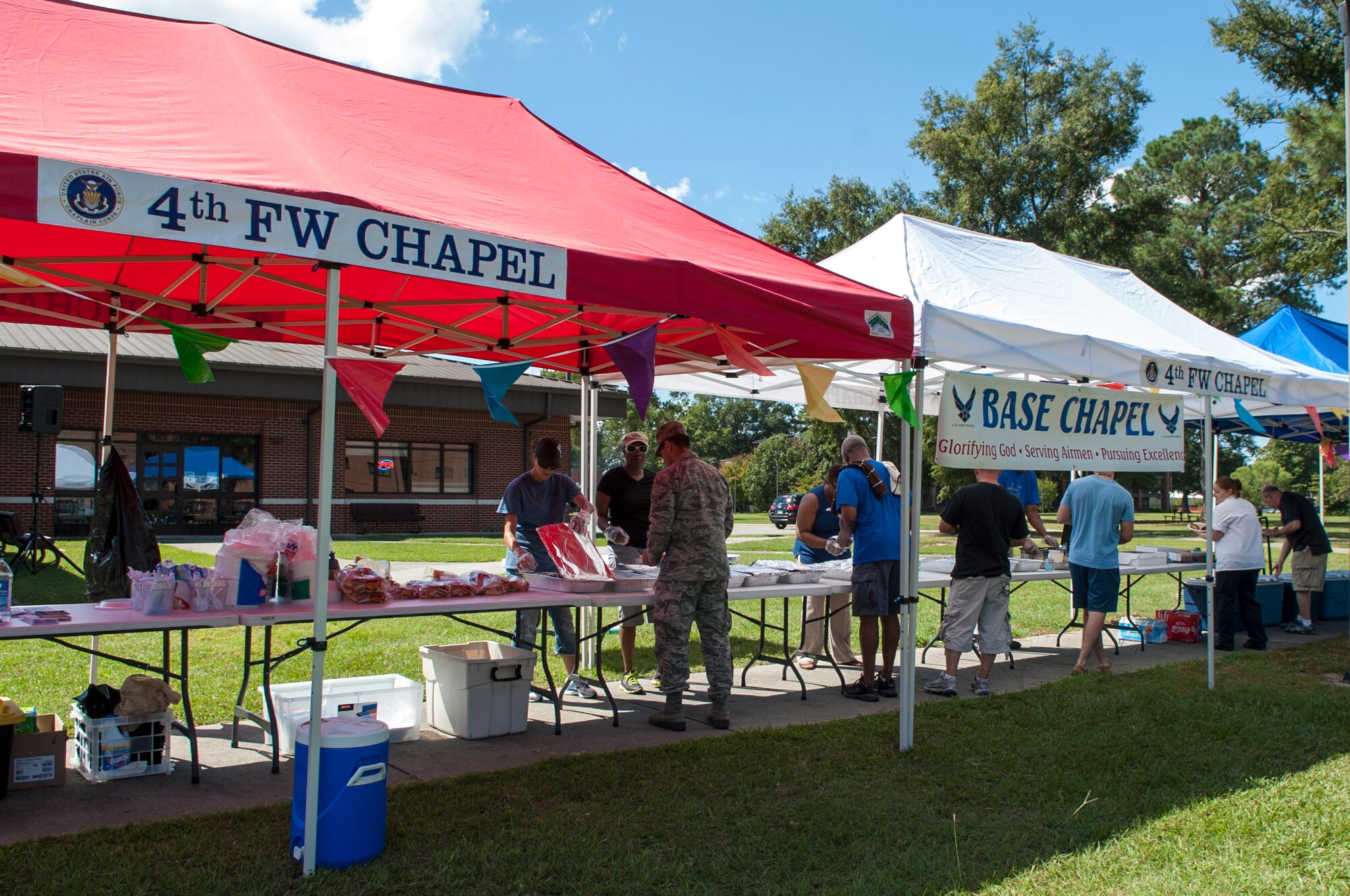 Dorm Airmen receive free food during a dorm dwellers barbecue event, Sept. 19, 2015, at Seymour Johnson Air Force Base, North Carolina. The biannual event, hosted by the 4th Fighter Wing Chaplain Corps’ Protestant Men of the Chapel, aims to give Airmen an avenue to get out of their dorms and enjoy time spent together. (U.S. Air Force photo/Airman 1st Class Shawna L. Keyes) 