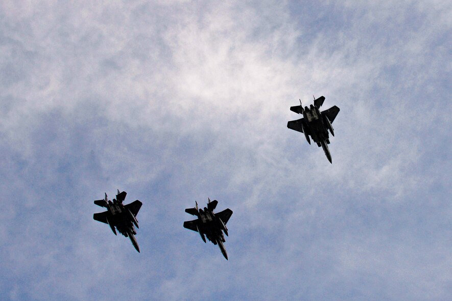 F-15E Strike Eagles perform a missing man flyover during the Prisoners of War/Missing in Action ceremony, Sept. 17, 2015, at Seymour Johnson Air Force Base, North Carolina. As four jets flew over the crowd, one separated from the pack, representing the POW/MIAs as the “missing man”. (U.S. Air Force photo/Airman 1st Class Ashley Williamson)