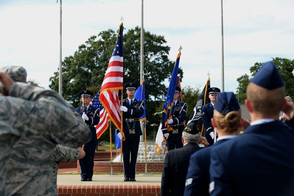 Airmen salute the colors during the closing ceremony for Prisoners of War/Missing in Action Remembrance Week, Sept. 17, 2015, at Seymour Johnson Air Force Base, North Carolina. The ceremony was closed by a recitation of the Loneliest Prayer by Del “Abe” Jones. (U.S. Air Force photo/Airman 1st Class Ashley Williamson)