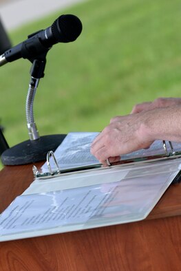 An Airman participating in the 24-hour Prisoners of War/Missing in Action memorial run reads names of the service members, Sept. 16, 2015, at Seymour Johnson Air Force Base, North Carolina. The teams of two or more switched between running and reading off the names for an hour. (U.S. Air Force photo/Airman 1st Class Ashley Williamson)