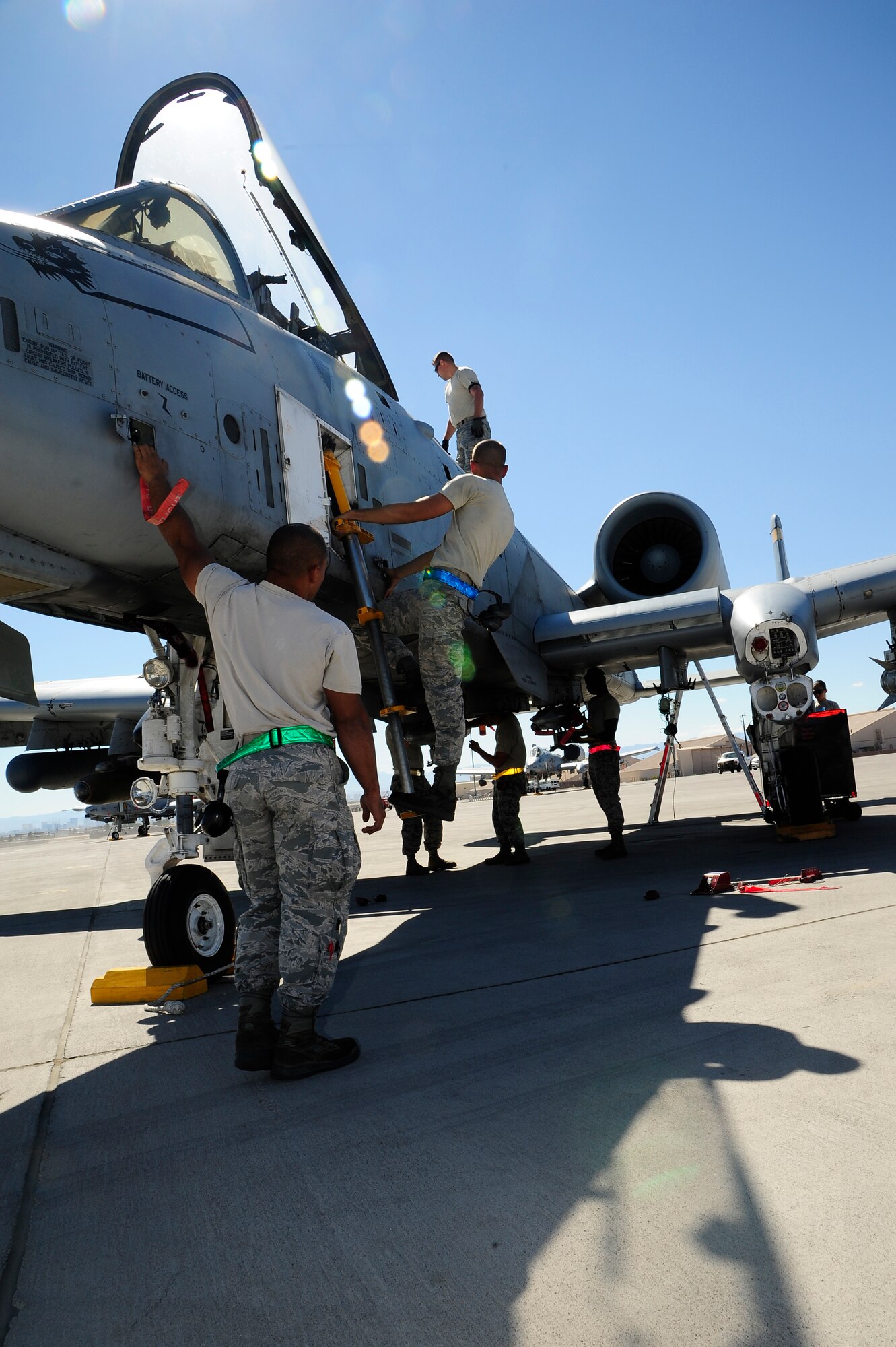 U.S. Airmen from the 355th Aircraft Maintenance Squadron recover an A-10 Thunderbolt II at Nellis Air Force Base, Nev., Sept 16, 2015. The 355th AMXS maintained eight A-10s from the 357th Fighter Squadron while participating in Green Flag-West 15-10. (U.S. Force photo by Senior Airman Betty R. Chevalier/Released)