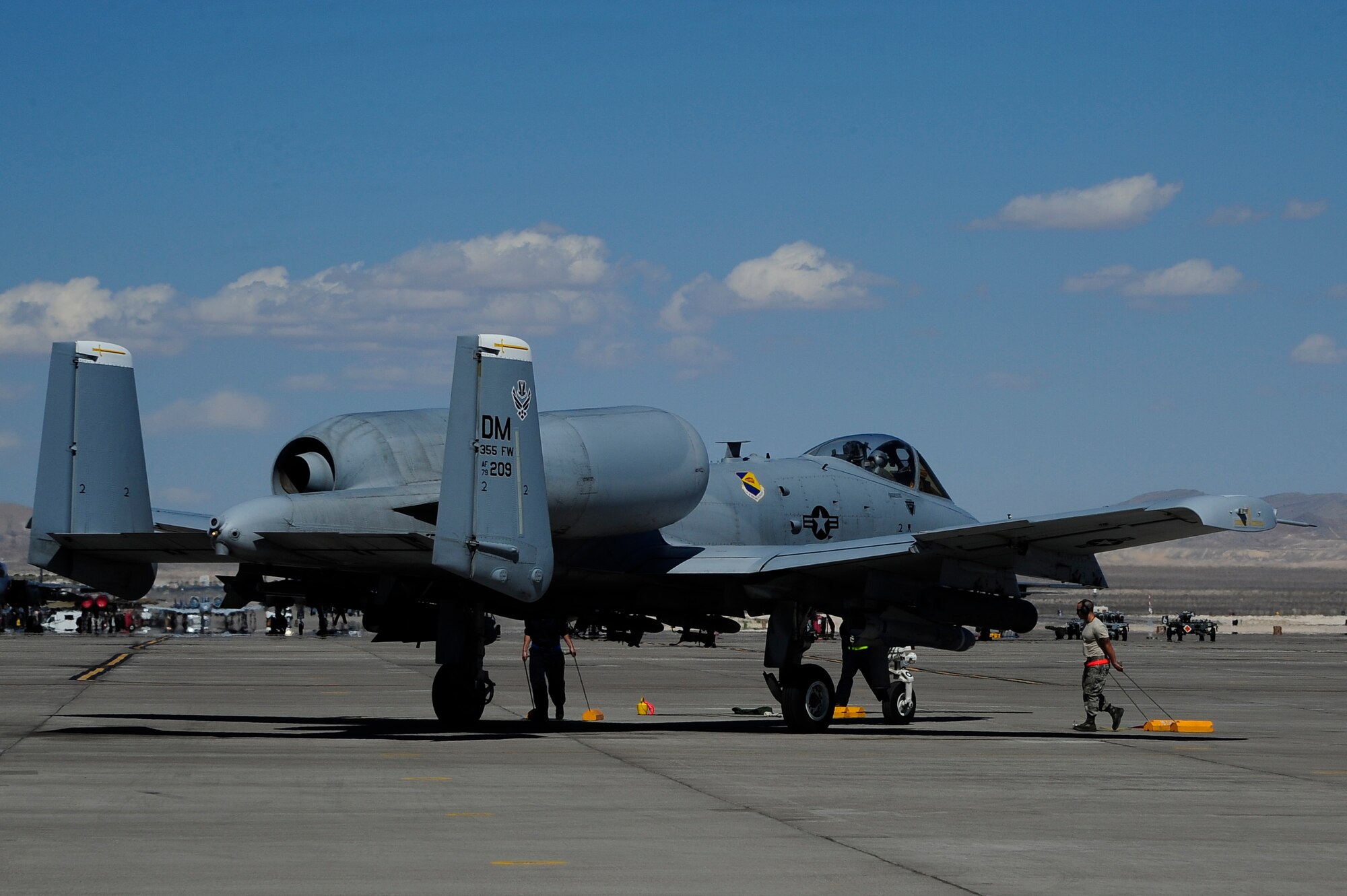 U.S. Airmen assigned to the 355th Aircraft Maintenance Squadron at Davis-Monthan Air Force Base, Ariz., recover an A-10 Thunderbolt II immediately after it lands at Nellis AFB, Nev., Sept. 16, 2015.  The 355th AMXS and 357th Fighter Squadron visited Nellis AFB to participate in Green Flag-West 15-10, a joint combat air support integration exercise.  (U.S. Air Force photo by Senior Airman Betty R. Chevalier/Released)
