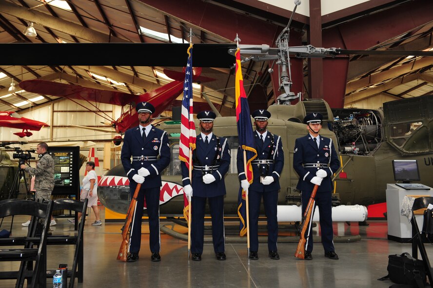 Davis-Monthan Air Force Base Honor Guardsmen, stand at parade rest prior to a POW/MIA Remembrance Ceremony at the Pima Air and Space Museum in Tucson, Ariz., Sept. 18, 2015. The ceremony was held to honor prisoners of war and those who are still missing in action. (U.S. Air Force photo by Senior Airman Cheyenne A. Powers/ Released)