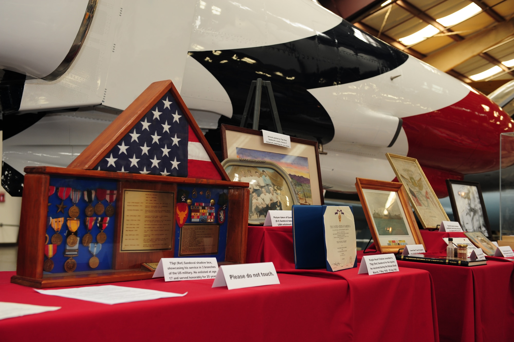Prisoner of war memorabilia is displayed during a POW/MIA Remembrance Ceremony at the Pima Air and Space Museum in Tucson, Ariz., Sept. 18, 2015. Local Tucson POW veterans who were captured during World War II, Vietnam and the Korean War provided memorabilia from their experiences as POWs to be displayed during the ceremony. (U.S. Air Force photo by Senior Airman Cheyenne A. Powers/ Released)