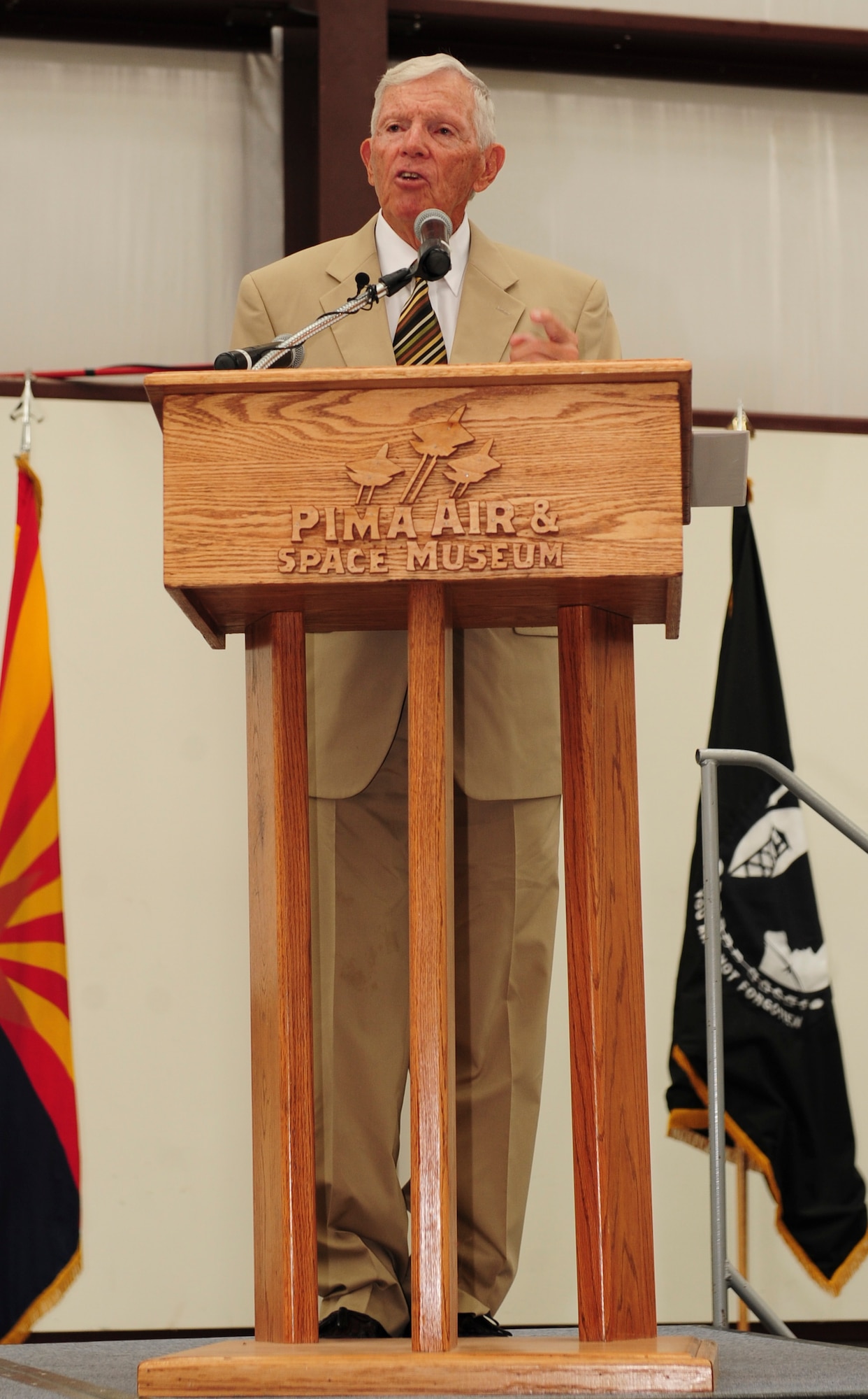 Retired U.S. Air Force Col. Thomas Kirk speaks during a POW/MIA Remembrance Ceremony at the Pima Air and Space Museum, Tucson, Ariz., Sept. 18, 2015. Kirk spent five and a half years as a prisoner of war during the Vietnam War. Kirk spoke about his experiences as a POW, “The experience taught me some valuable lessons, to have faith in America, have faith in your fellow man, faith in religion and faith in yourself.” (U.S. Air Force photo by Senior Airman Cheyenne A. Powers/ Released)  
