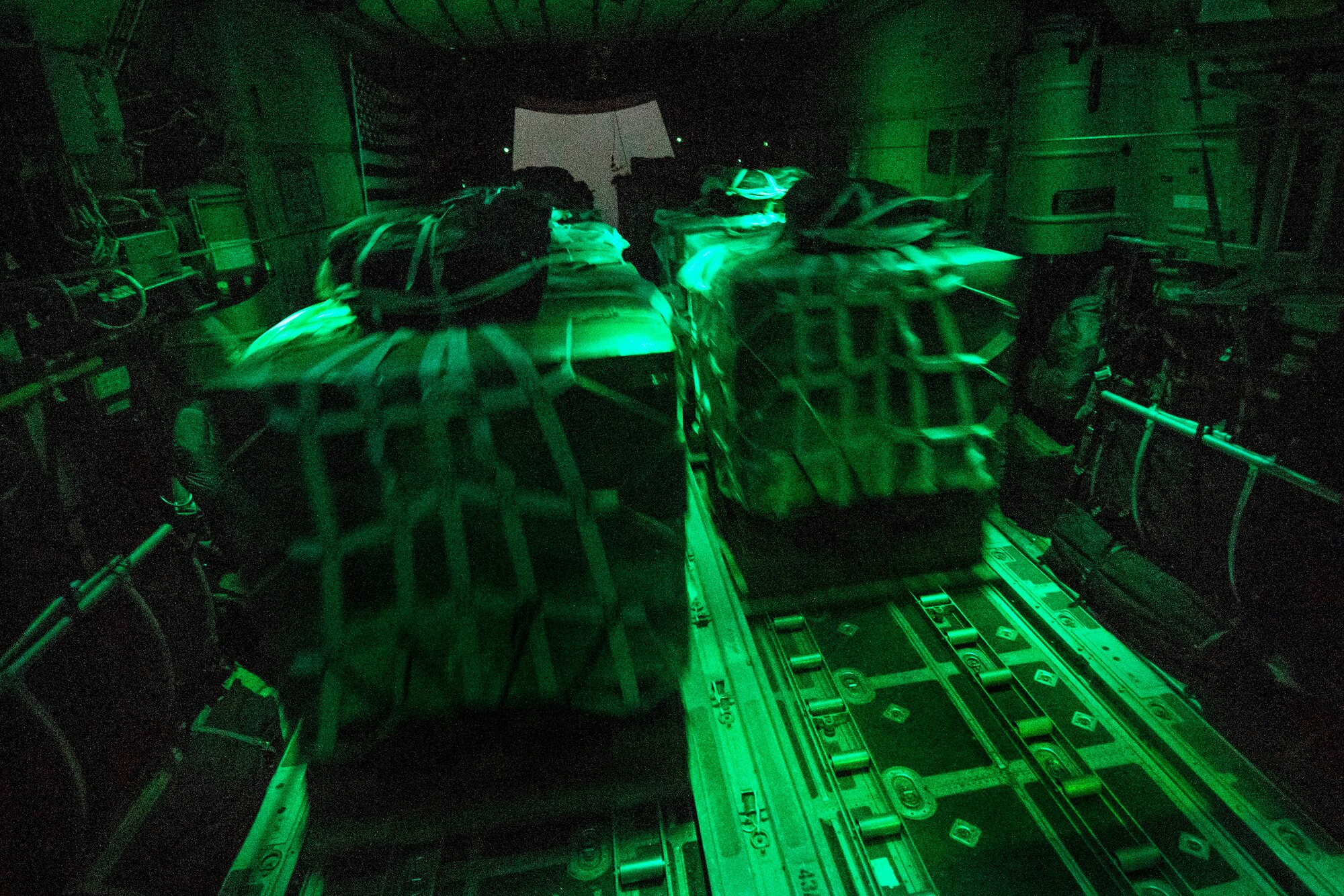 Container delivery system bundles are dropped out of a U.S. Air Force C-130 Hercules aircraft over Bayji, Iraq, Oct. 11, 2014. (U.S. Air Force photo by Senior Airman Matthew Bruch)