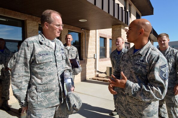 Air Force Senior Master Sgt. Andre Bellamy, 43rd Air Mobility Squadron operations superintendent, right, briefs Brig. Gen. James Scanlan, mobilization assistant to the U.S. Air Force Expeditionary Center commander, left, about aerial port and aircraft maintenance operations during Scanlan's visit to Pope Army Airfield, North Carolina, Sept. 17-18. (U.S. Air Force photo/Marvin Krause)
