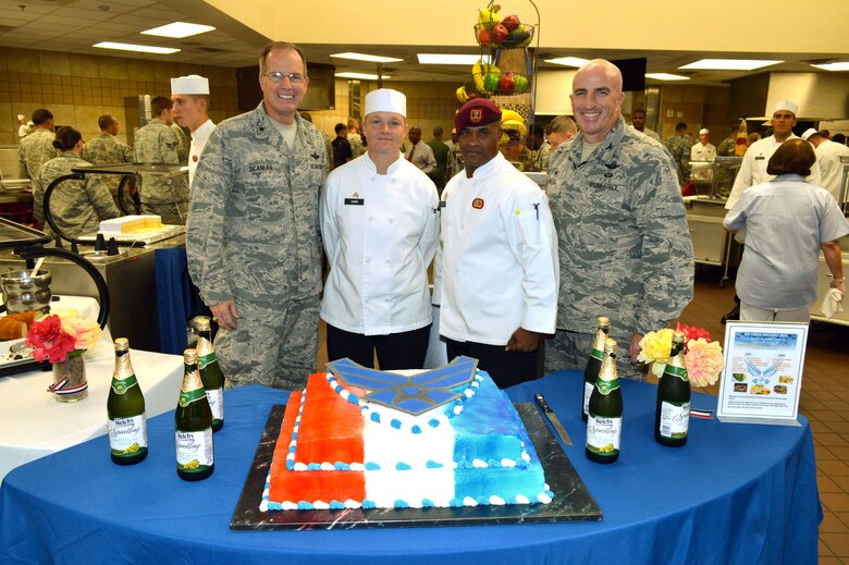 Air Force Brig. Gen. James Scanlan, mobilization assistant to the U.S. Air Force Expeditionary Center commander, and Col. Kenneth Moss, 43rd Airlift Group commander, pose for a photo with Army Sgt. 1st Class Jammie Brooks, food services NCOIC and Sgt. Lewis of the 2nd Brigade Combat Team/18th Field Artillery Brigade dining facility, during a lunch honoring the U.S. Air Force's 68th birthday at Fort Bragg, North Carolina, Sept. 17. Scanlan also met with 43rd AG Airmen during his visit to Pope Army Airfield Sept. 17-18.
(U.S. Air Force photo/Marvin Krause)
