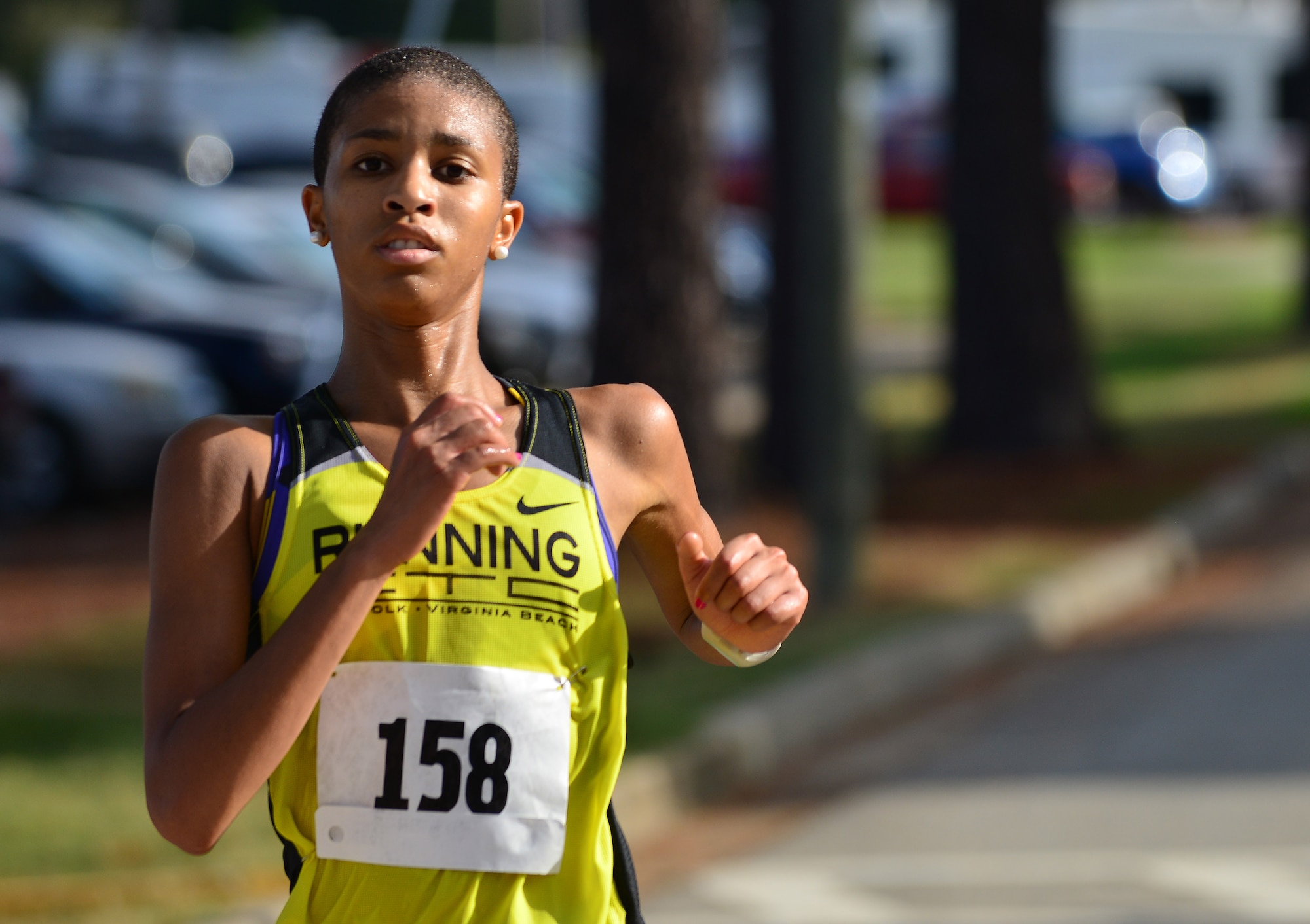 Octavia Rhinehardt of Virginia Beach, Va., runs to the Mulberry Island Half Marathon finish line at Fort Eustis, Va., Sept. 19, 2015. Rhinehardt finished first for women and finished seventh overall with a time of 1:27:19. (U.S. Air Force photo by Staff Sgt. Natasha Stannard/Released)