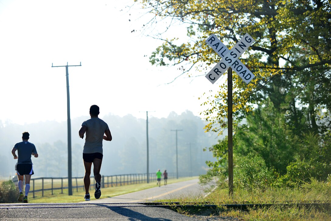 Mulberry Island Half Marathon participants approach the halfway point of the race at Fort Eustis, Va., Sept. 19, 2015.  The course took participants past not only natural views, but historic sites such as the Matthew James House and an early American brick factory located on Fort Eustis. (U.S. Air Force photo by Staff Sgt. Natasha Stannard/Released)