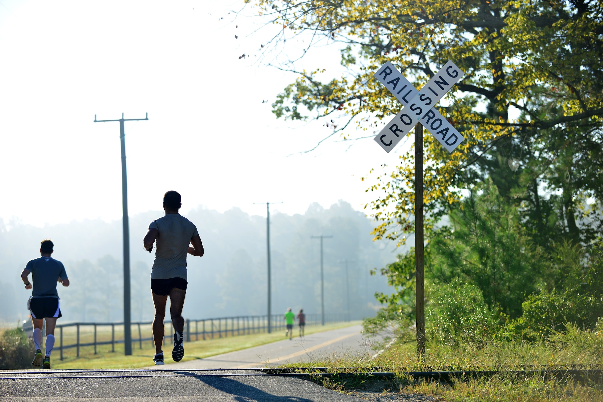 Mulberry Island Half Marathon participants approach the halfway point of the race at Fort Eustis, Va., Sept. 19, 2015.  The course took participants past not only natural views, but historic sites such as the Matthew James House and an early American brick factory located on Fort Eustis. (U.S. Air Force photo by Staff Sgt. Natasha Stannard/Released)
