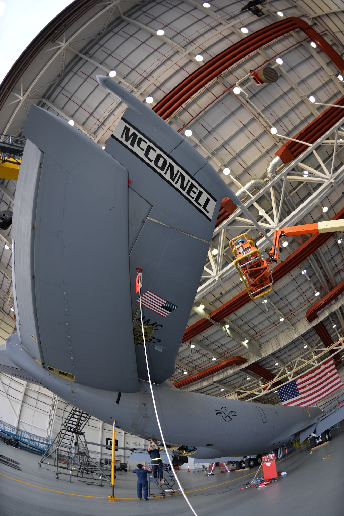 The tail of a KC-135 Stratotanker lays at an angle while in the process of being removed Sept. 11, 2015, on RAF Mildenhall, England. The jet, formerly from McConnell Air Force Base, has been reassigned to RAF Mildenhall and underwent a full isochronal inspection, with the addition of the tail removal. It will soon be repainted and given the Square D markings. (U.S. Air Force photo by Karen Abeyasekere/Released)