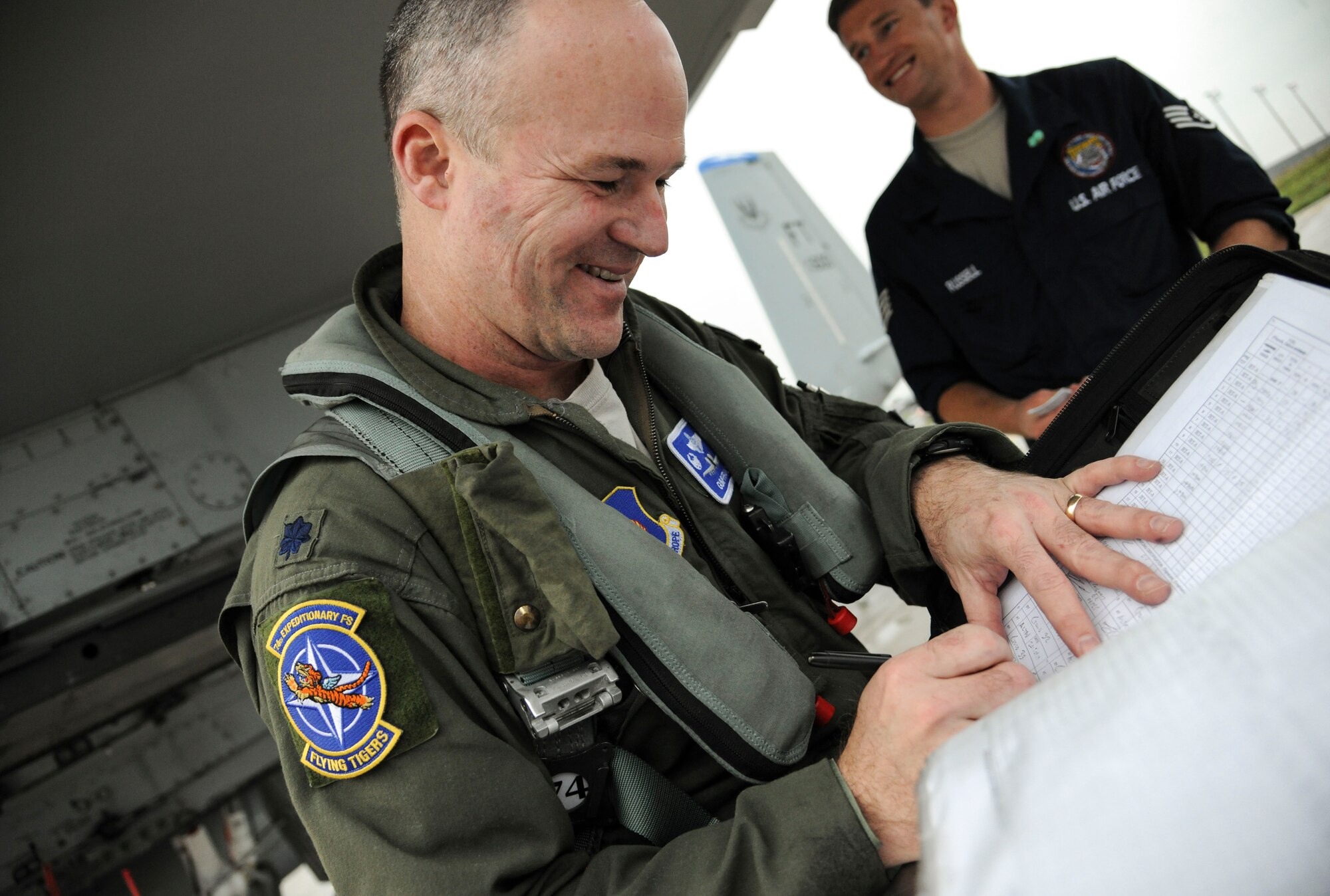 U.S. Air Force Lt. Col. Bryan France, 74th Expeditionary Fighter Squadron commander, signs off on post-flight data after landing at Amari Air Base, Estonia, Sept 21, 2015. France will lead more than 350 Airmen during a six-month Theater Security Package deployment and will conduct training with NATO allies designed to strengthen interoperability. (U.S. Air Force photo by Andrea Jenkins/Released)