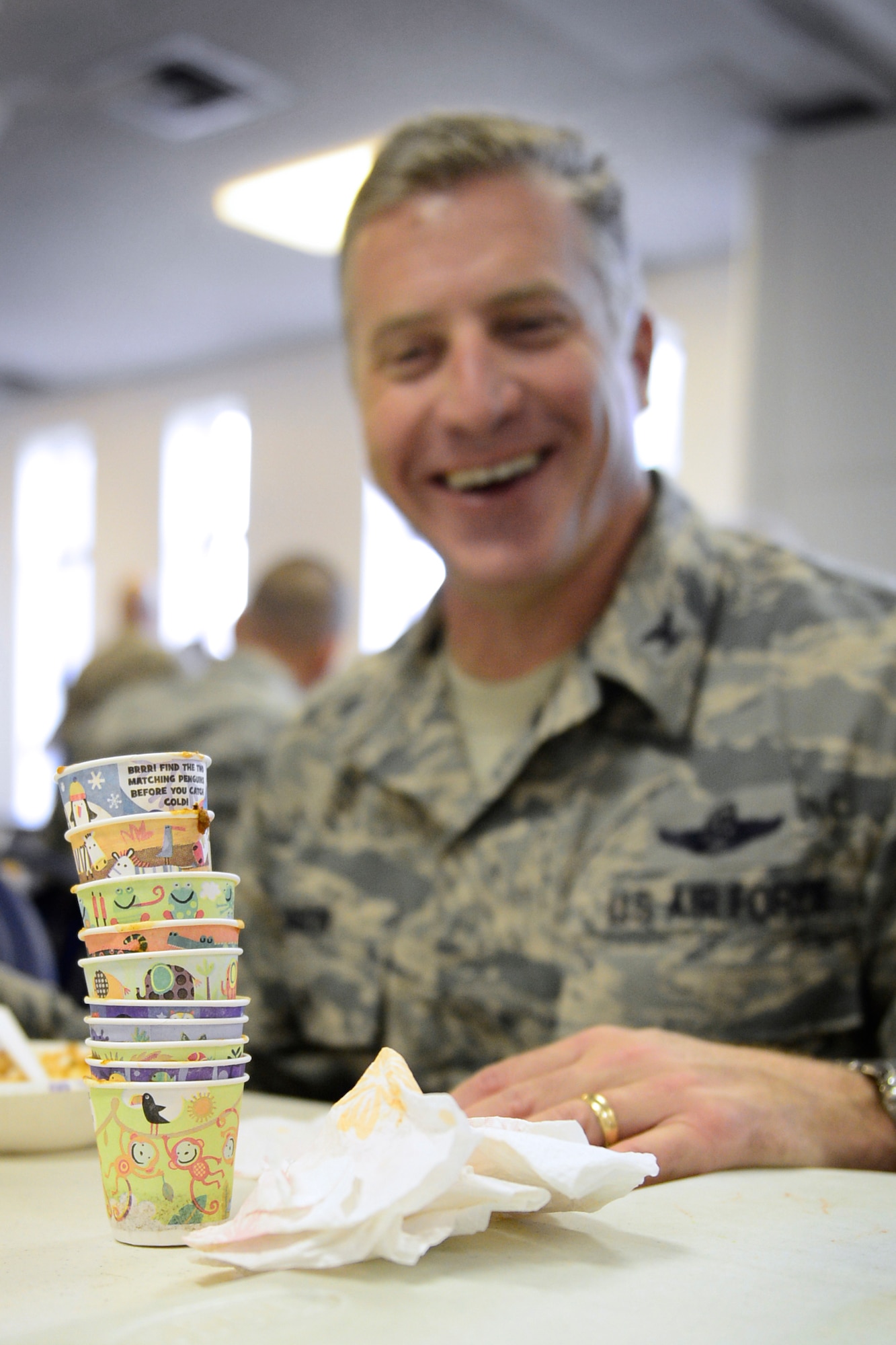 Col. David Eaglin, 48th Fighter Wing vice commander, stacks his empty chili-tasting cups at the Combined Federal Campaign Chili Cook-off event at Royal Air Force Lakenheath, England, Sept. 21, 2015. The purpose of the campaign is to raise funds for charitable organizations in the Federal workplace. (U.S. Air Force photo by Airman 1st Class Erin R. Babis/Released) 