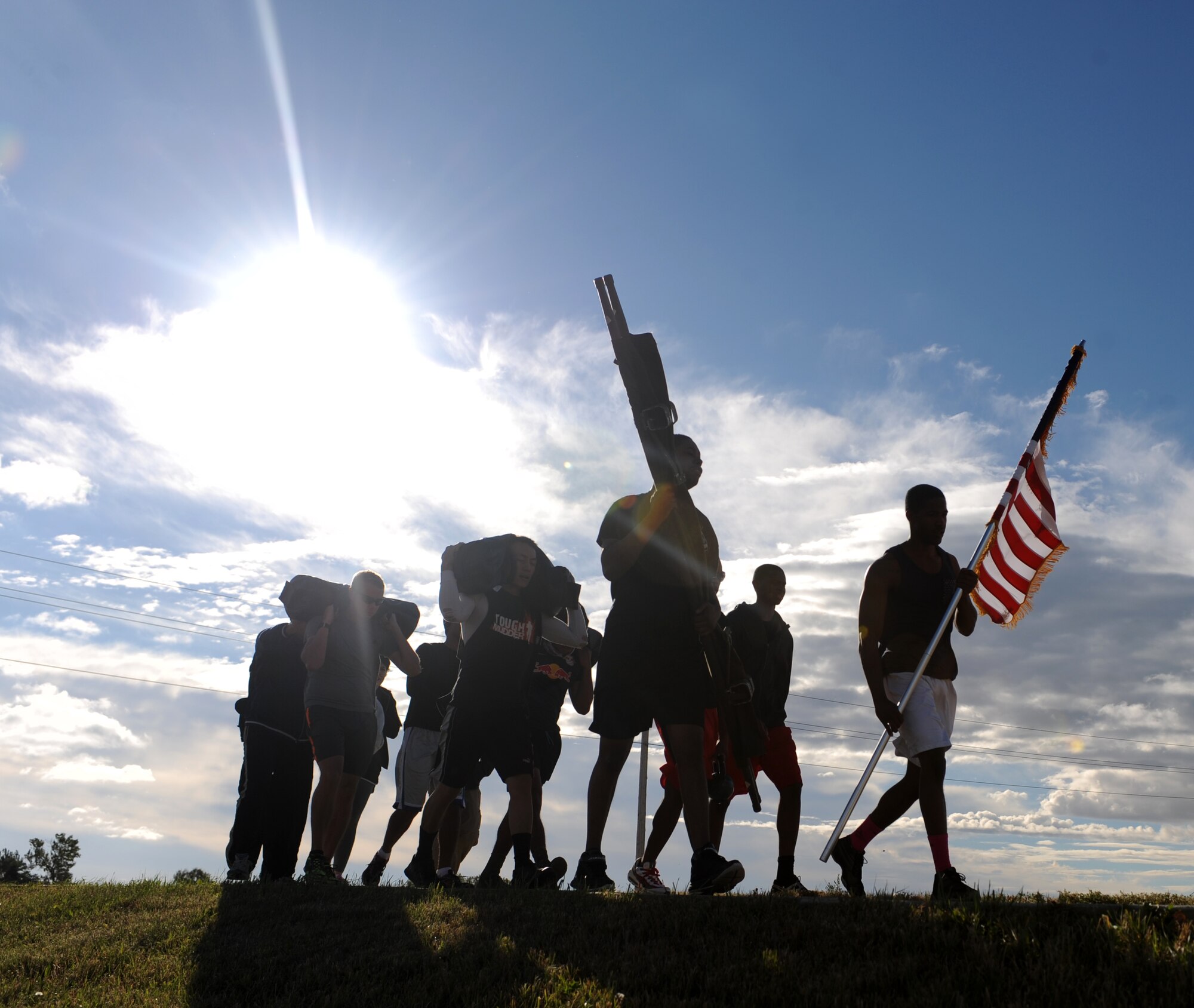 Ellsworth Airmen participate in a team cohesion challenge as part of a ruck march at Ellsworth Air Force Base, S.D., Sept. 18, 2015. The team traveled approximately 8.5 miles from the Bellamy Fitness Center to Douglas High School, Box Elder, S.D. (U.S. Air Force photo by Airman Sadie Colbert/Released)