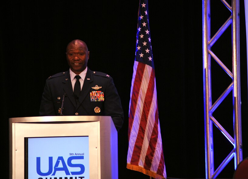 Col. Rodney Lewis, 319th Air Base Wing commander, speaks at the Ninth Annual UAS Summit and Expo Grand Sky Congressional Breakfast in Grand Forks, North Dakota, Sept. 21, 2015. The event consisted of more than 200 attendees including representatives from the governor’s office and the North Dakota senators. (U.S. Air Force photo by Airman 1st Class Bonnie Grantham/released)