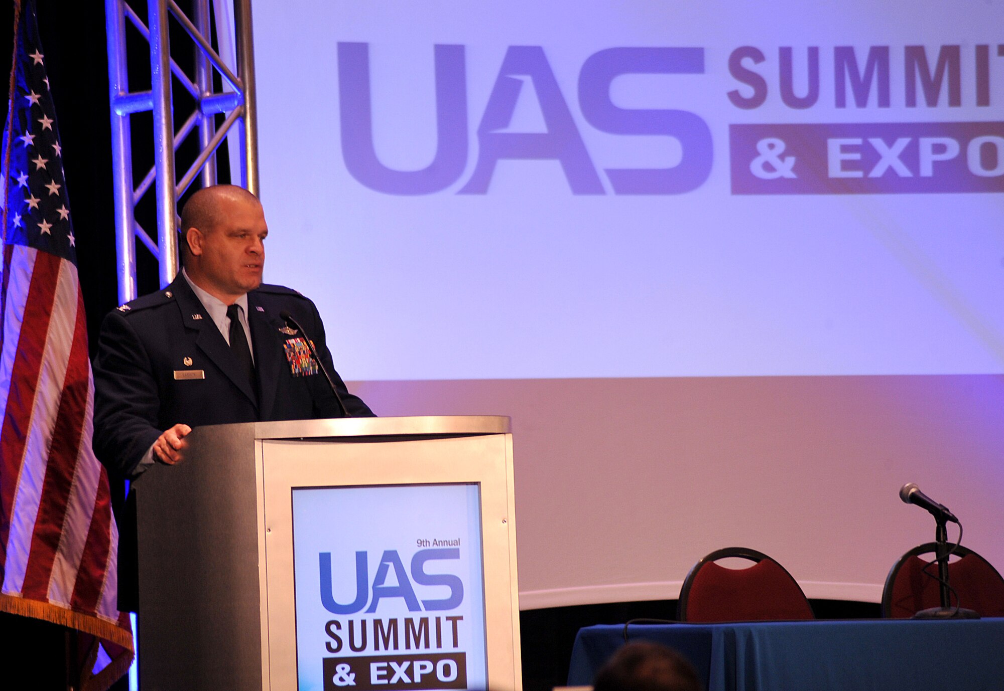 Col. Christopher Larson, 69th Reconnaissance Group commander, briefs attendees of the Ninth Annual UAS Summit and Expo Grand Sky Congressional Breakfast of the importance of the integration of manned and unmanned aerial systems in Grand Forks, North Dakota, Sept. 21, 2015. More than 200 people attended the Congressional Breakfast including representatives from the governor’s office and North Dakota senators. (U.S. Air Force photo by Airman 1st Class Bonnie Grantham/released)
