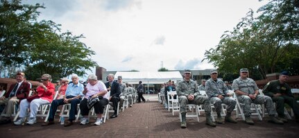 Members of Joint Base Charleston wait for the POW/MIA retreat ceremony to begin Sept. 18, 2015, at the base flagpole on JB Charleston – Air Base, S.C. The ceremony included a 21-gun salute by the Honor Guard, a wreath-laying and a live bugle performance in recognition of captured and missing U.S. servicemembers. (U.S. Air Force photo/Airman 1st Class Clayton Cupit)