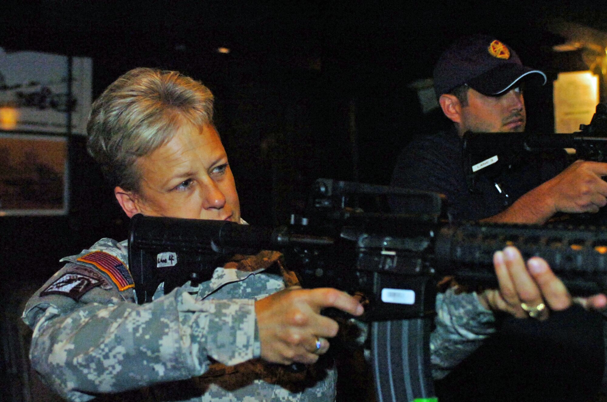 United States Army Support Activity, Fort Dix Commander, Col. Shelley L. Balderson provides  the activity’s newest honorary commander Marc Zamarin, the director of Ticket Sales and Service for the Philadelphia Soul, training with the Equipment Skills Trainer 2000-a simulator used to familiarize personnel on various individual weapons on the battlefield. (Image by Master Sgt. David Moore/NJARNG)   
