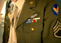 Muscian in vintage World War II uniform at the Air Force ball at Minot AFB, N.D., Sept. 19, 2015. The Air Force ball celebrates the birth of the U.S. Air Force which was created on Sept. 18, 1947. (U.S. Air Force photo by Senior Airman Apryl Hall)