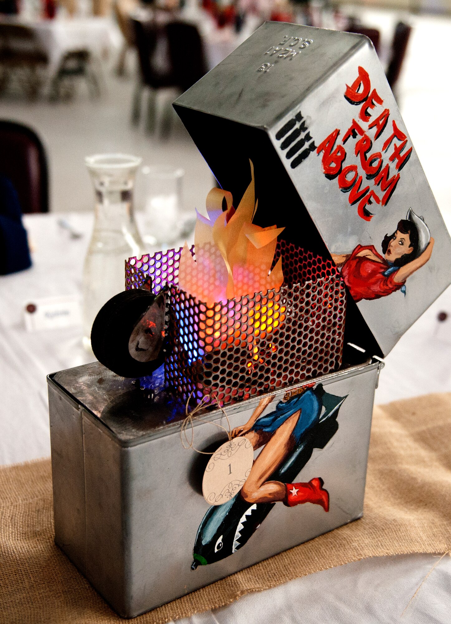 An ammo can center piece at the Air Force ball at Minot AFB, N.D., Sept. 19, 2015. The Air Force ball celebrates the birth of the U.S. Air Force which was created on Sept. 18, 1947. (U.S. Air Force photo by 2d Lt. Kylee Ashton)
