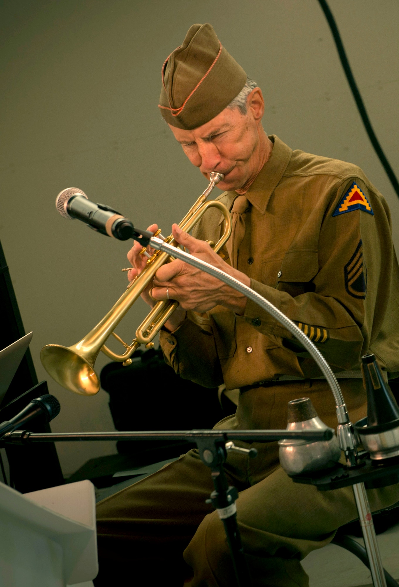 Muscian in vintage World War II uniform at the Air Force ball at Minot AFB, N.D., Sept. 19, 2015. The Air Force ball celebrates the birth of the U.S. Air Force which was created on Sept. 18, 1947. (U.S. Air Force photo by Senior Airman Apryl Hall)