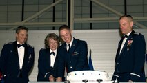 Col. Jane Holtzclaw, 5th Medical Group, with Airman Basic John Vrabel III, cut the official Air Force birthday cake with Col. Jason Armagost, 5th Bomb Wing Commander and Col. Michael Lutton, 91st Missile Wing Commander, at the Air Force ball at Minot AFB, N.D., Sept. 19, 2015. The Air Force ball celebrates the birth of the U.S. Air Force which was created on Sept. 18, 1947. (U.S. Air Force photo by Senior Airman Apryl Hall)