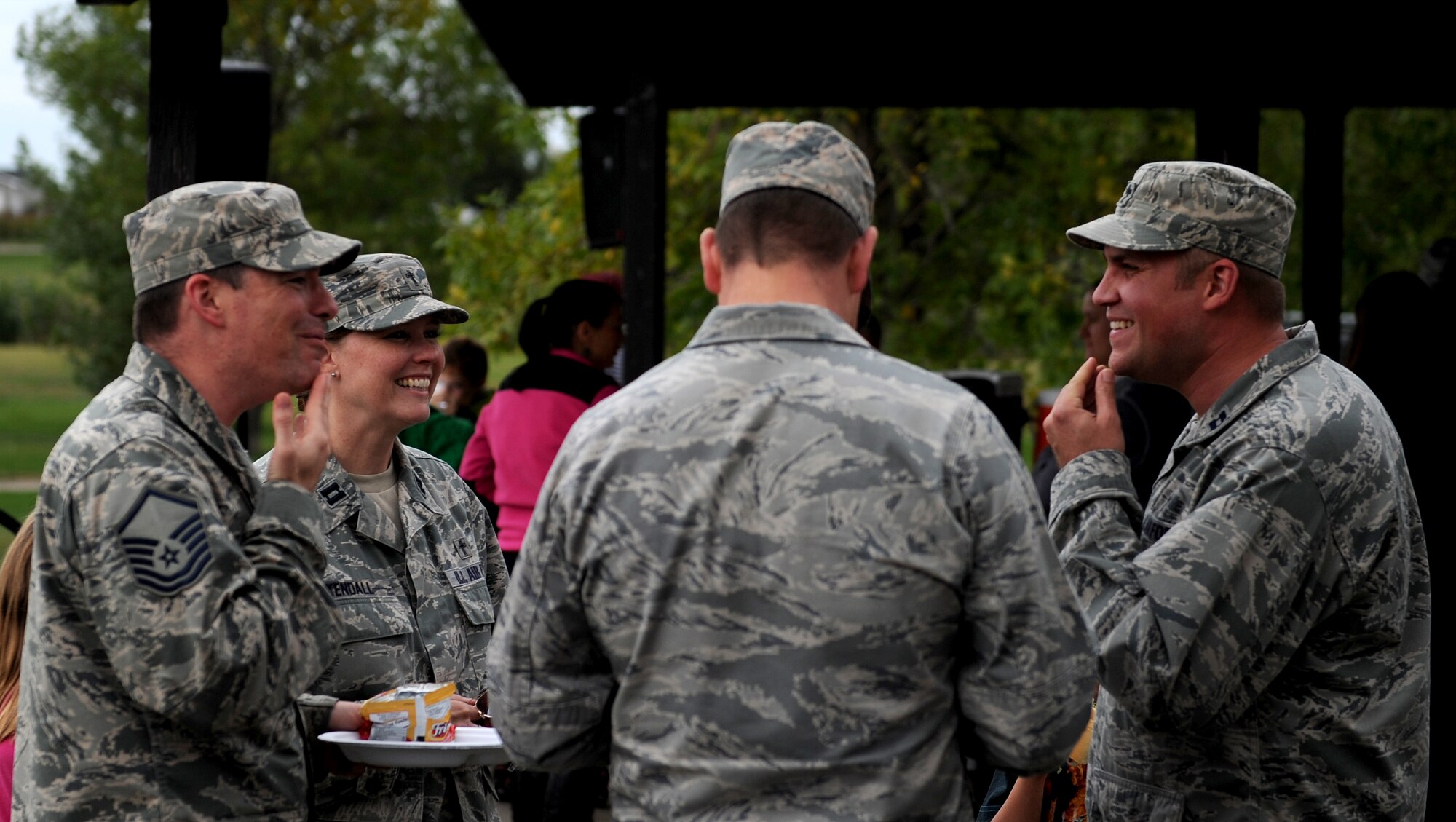 Members of the base chapel at Bud Ebert Park at Minot AFB, N.D. Sept. 16, 2015. The base chapel handed out information about programs that they provide as part of a carnival they put on for the Airmen and their families of Minot AFB. (U.S. Air Force photo by Staff Sgt. Chad Trujillo)

