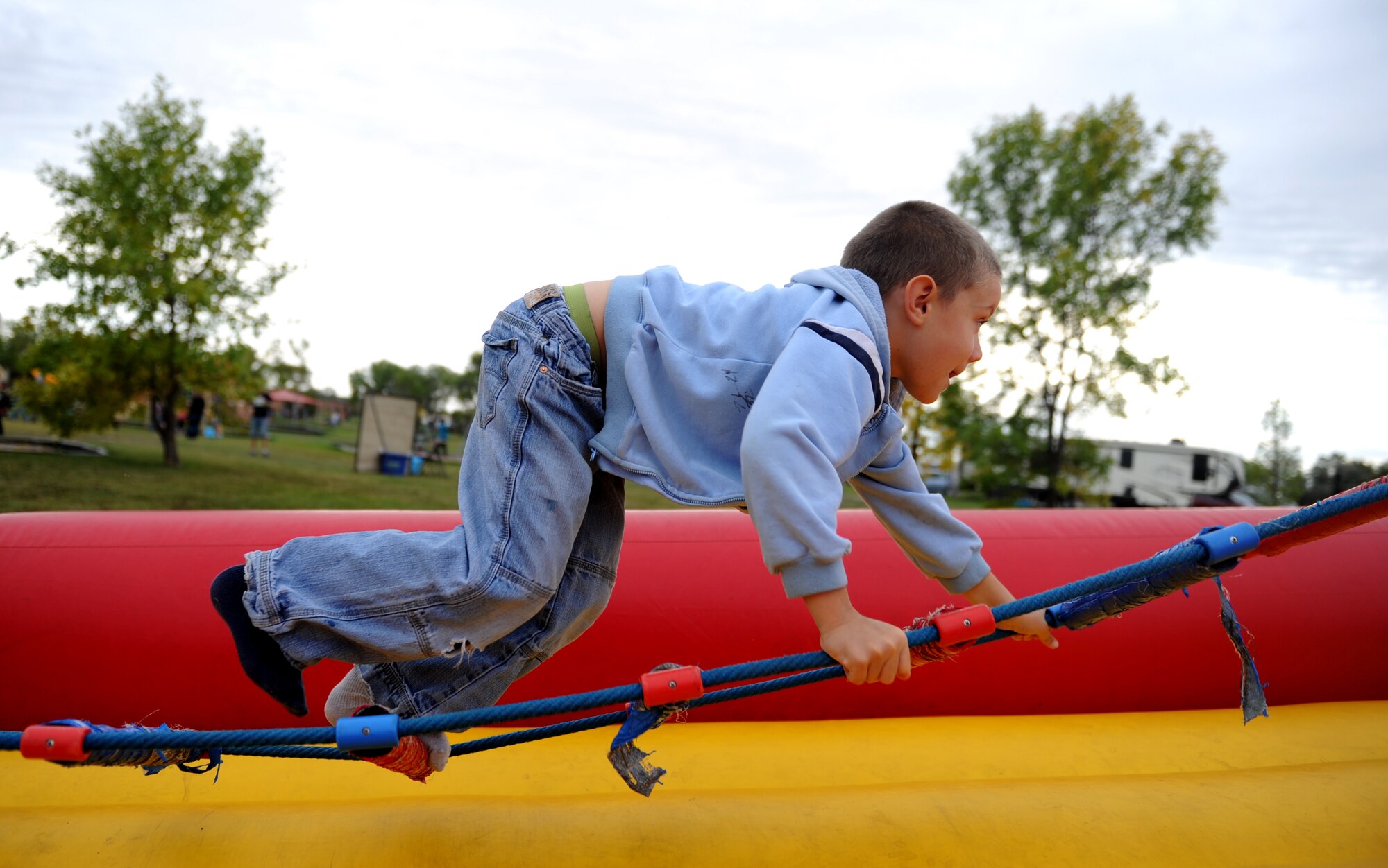 Ashton Trujillo plays on a Jacob's Ladder at Bud Ebert Park oat Minot AFB, N.D. Sept. 16, 2015.The Jacob's Ladder was part of a carnival that base chapel put on for the Airmen and their families of Minot AFB. (U.S. Air Force photo by Staff Sgt. Chad Trujillo)