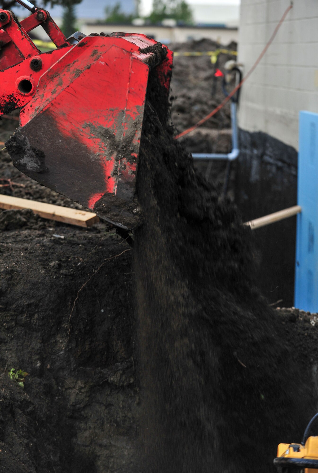 William Marier, contractor, fills in dirt for a new airfield lighting system building sidewalk at Minot Air force Base, N.D., Sept. 17, 2015. The building is receiving new sewer systems, an updated internal structure, new sidewalks and electrical systems. (U.S. Air Force photo/Senior Airman Stephanie Morris)