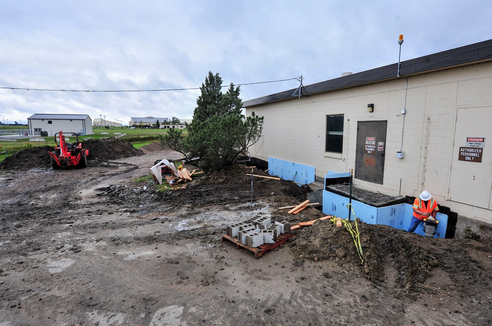 Construction continues on the new airfield lighting system building sidewalk at Minot Air force Base, N.D., Sept. 17, 2015. Updates to the ALSB, which supplies power to runway lighting, are slated for completion in July 2016. (U.S. Air Force photo/Senior Airman Stephanie Morris)