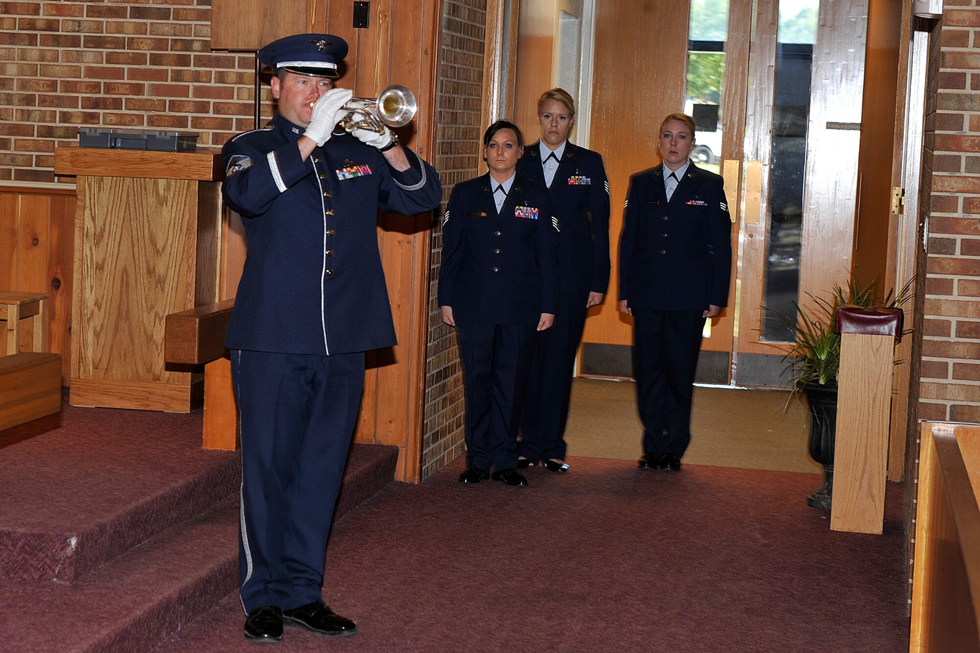 PETERSON AIR FORCE BASE, Colo. – Master Sgt. Tim Allums, U.S. Air Force Academy Band, plays Taps during the POW/MIA Remembrance Ceremony at the Peterson Chapel on Sept. 18. (U.S. Air Force photo by Dennis Howk)